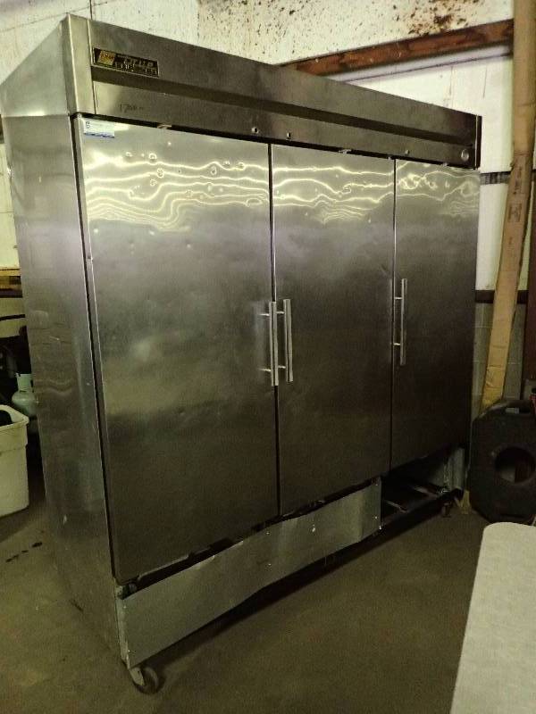 lot 592 image: True 3 Door Stainless Commercial Freezer On Casters
