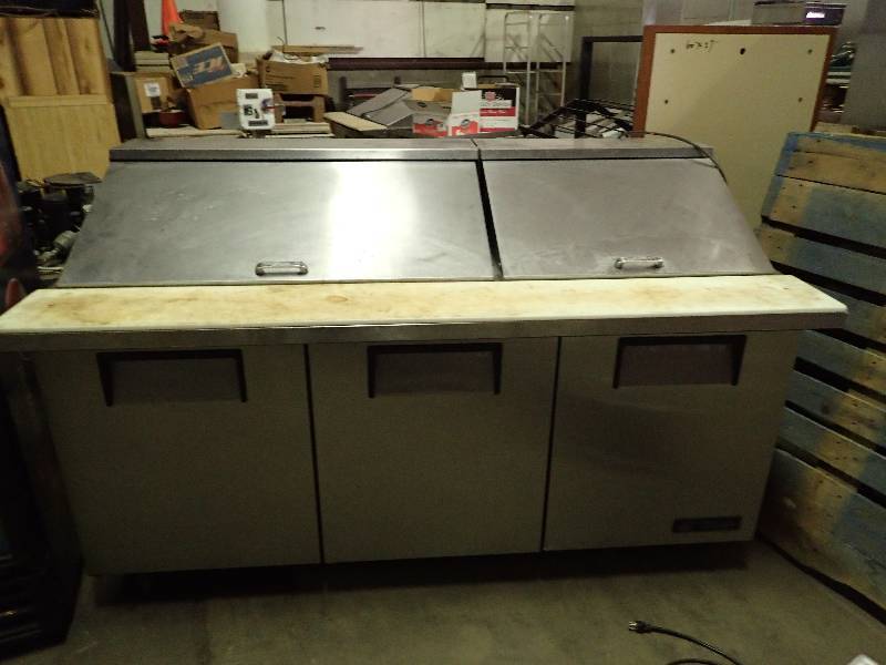 lot 668 image: True 3 Door 72 Refrigerated Sandwich Prep Table on Casters