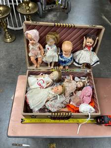 lot 60557 image: suitcase of old dolls parts and clothes