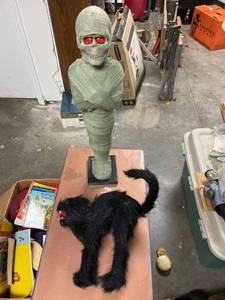 lot 60574 image: mummy with red flashing eyes and black cat