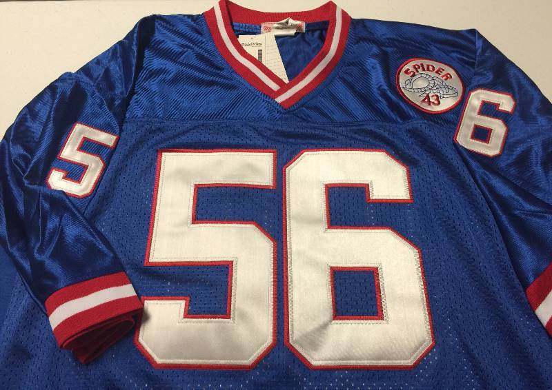 Why does Lawrence Taylor wear spider 43 on his jersey?