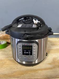 lot 9915 image: Insta Pot 6 Qt Duo 7-In-1 Pressure Cooker (silver) (Melted)