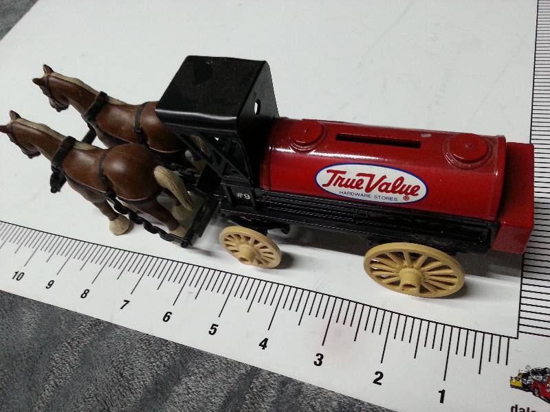 lot 1058 image: Ertl Horse and Buggy #9 wagon with pair of rubber horses is this Tru Value Hardware truck bank.  Christmas is coming soon