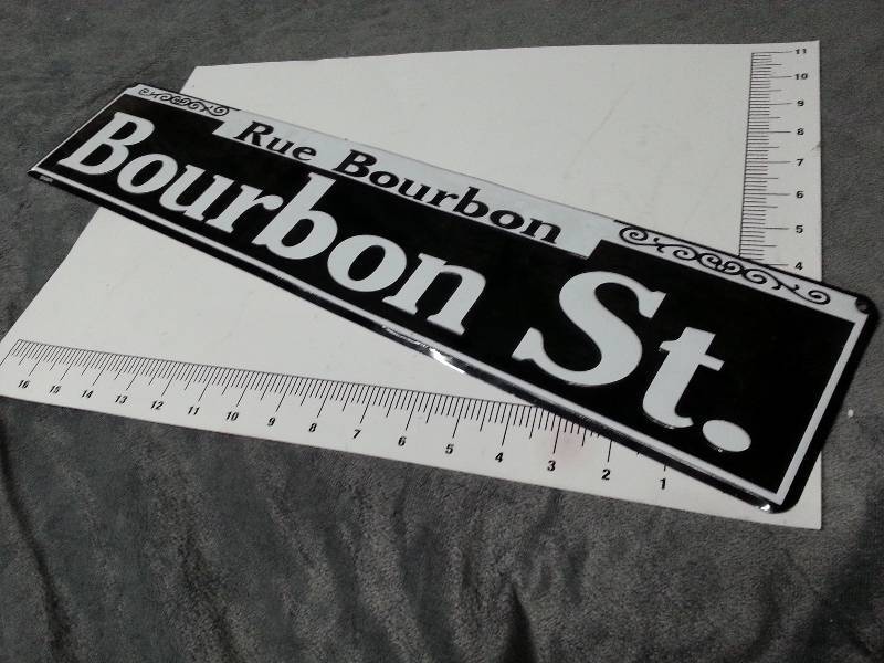 lot 1035 image: Dress your bedroom wall or shop up with this lightweight aluminum Bourbon Street sign
