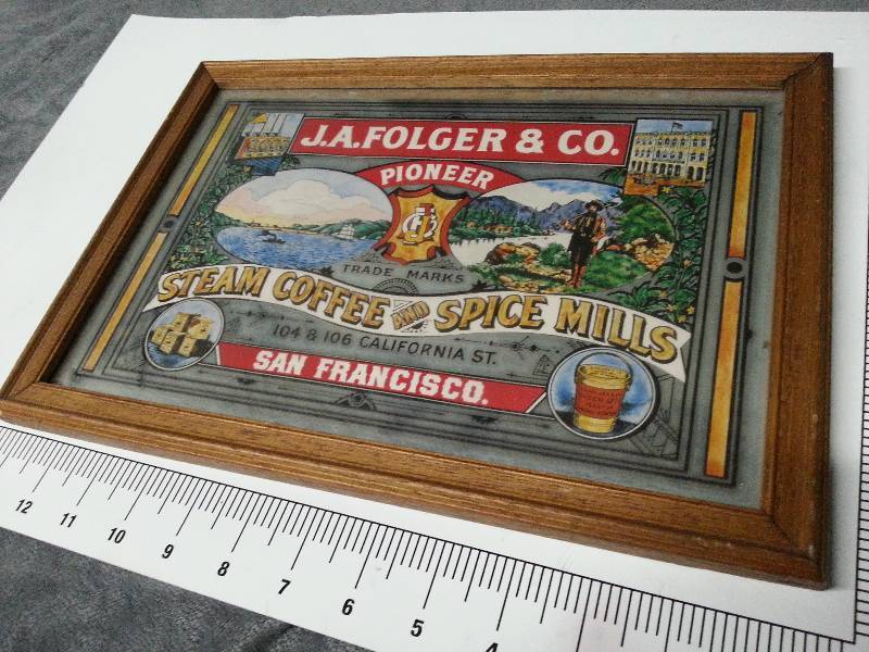 lot 1030 image: Kitchen or behind the bar wood framed mirror with old Folgers coffee ad