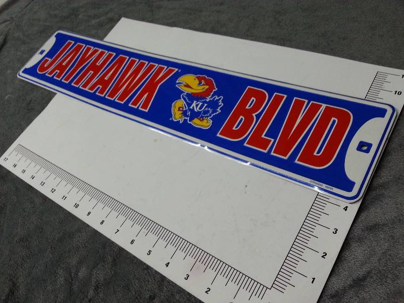 lot 1013 image: Dress your bedroom wall or shop up with this lightweight aluminum Jayhawk Blvd sign
