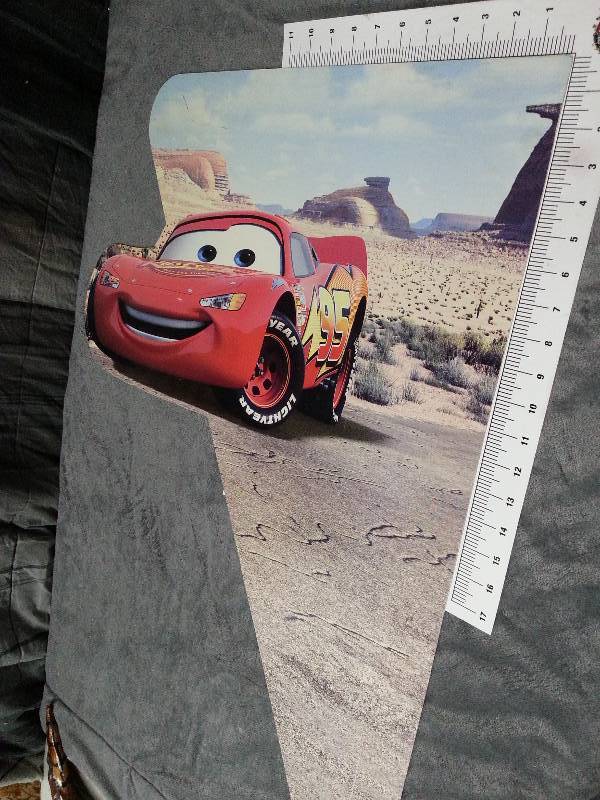 lot 1018 image: Large Lightning McQueen heavy plastic triangle counter or display shelf insert or maybe a bed end.