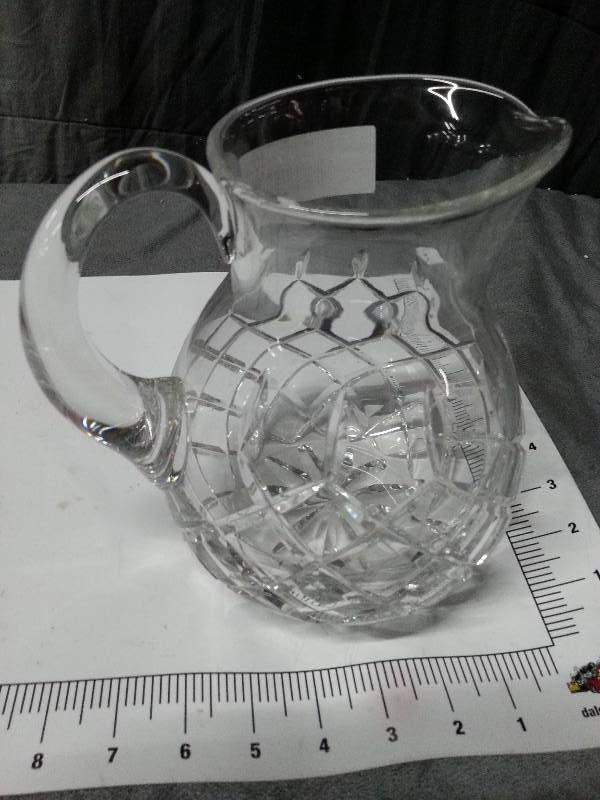 lot 1001 image: Very heavy and Im betting crystal on this clear glass pitcher