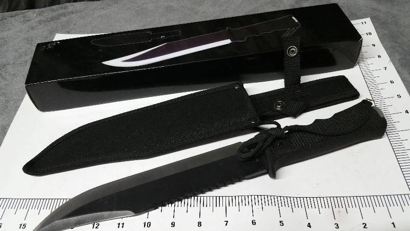 lot 1021 image: I see no evidence of any  use on this 16-18 Bowie style Survival knife, sheath and storage box.