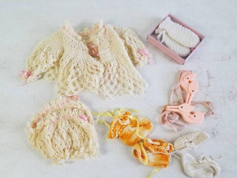 lot 6119 image: Lot of Vintage Handmade Baby Clothes and Vintage Blanket Crib Strap Set