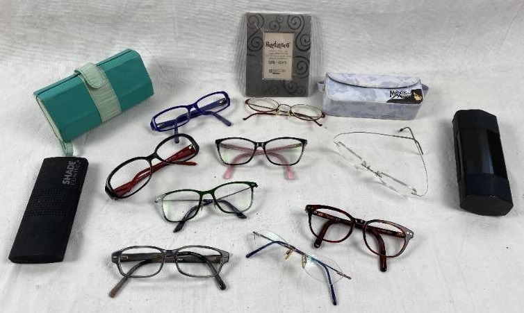 lot 6219 image: Lot of Eyeglasses Frames and a Clear Modular Holder