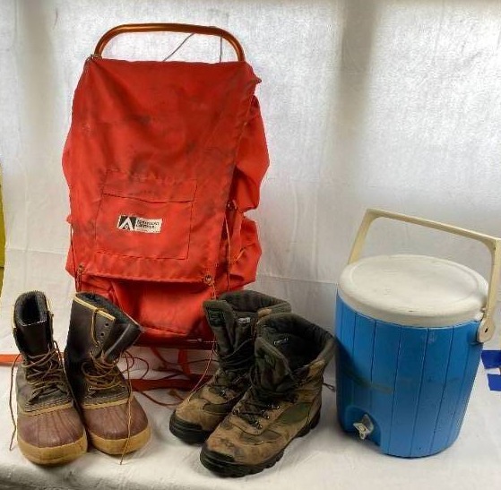 lot 6230 image: American Camper Hunting Back Pack Stock #4740 - 2 Pairs of Hunting Boots (One for Rain) Size 13 - and a Cooler