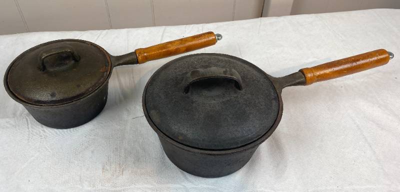 lot 6298 image: 2 Cast Iron, HEAVY DUTY Wood Handle Pans w Lids