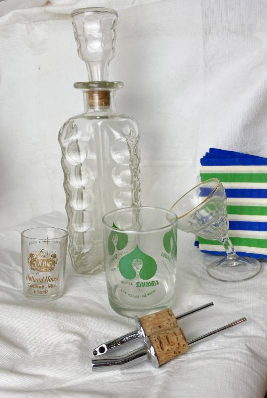 lot 6350 image: Its Vintage Cocktail Hour Decanter, Casino Sahara Glass, Tipsy Wine Glass , Holland House Jigger and More