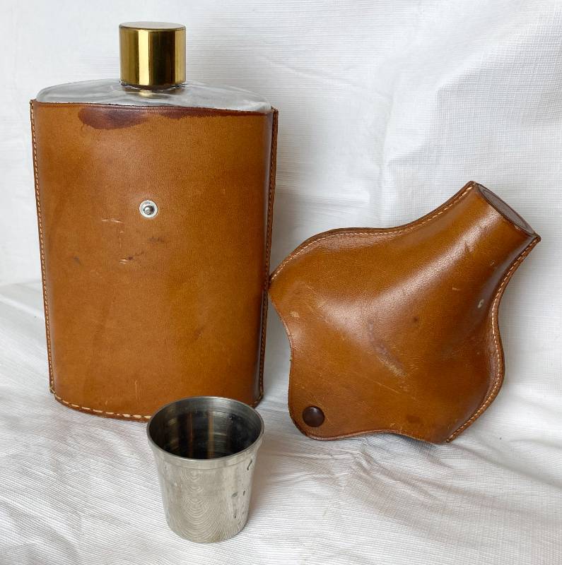 lot 6351 image: Vintage Whiskey Flask Glass  W Leather Case - Not a Small one Take a look at the size - Topper is a Shot Glass