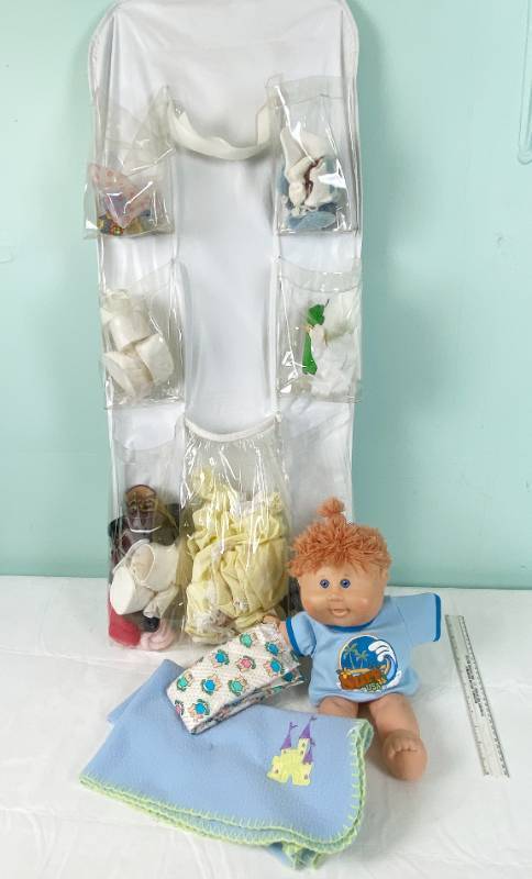 lot 6364 image: Vintage Cabbage Patch Doll, Baby Doll Accessories and a Hanging Storage Bag