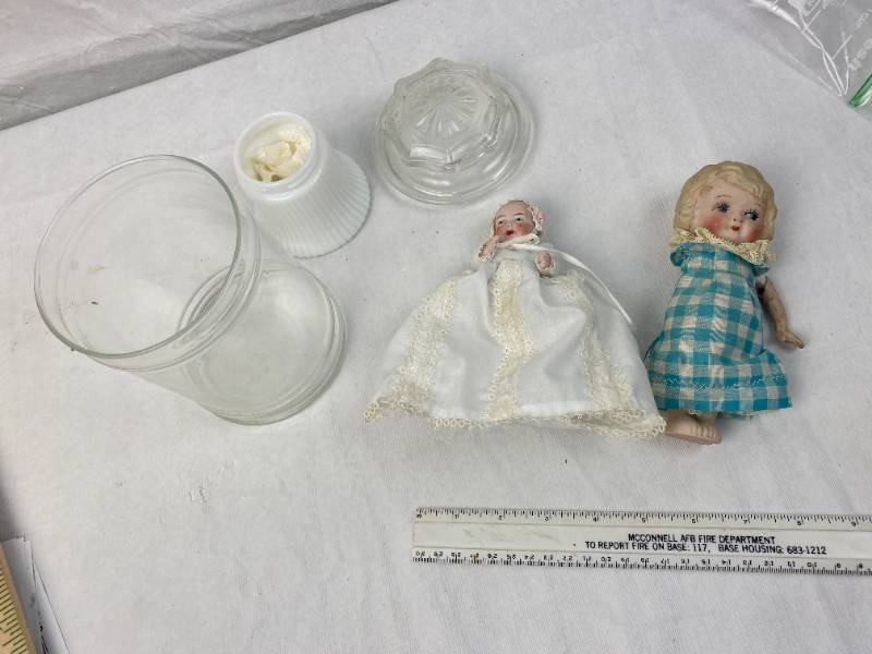 lot 9485 image: Lot of Porcelain Baby Dolls and Display Jar, Avon Jar - Larger Doll&nbsp is missing an arm. Highly Collectible dolls