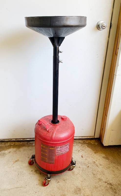 lot 9956 image: Rolling, Telescoping Oil Drain Pan and Catch Container - Handy for your shop