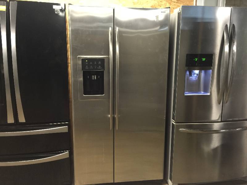 lot 1157 image: GE Profile CustomStyle 22.6 Cu. Ft. Stainless Side-By-Side Refrigerator