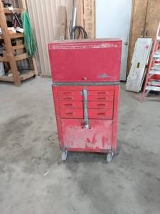 lot 3 image: 2 toolbox top box is a Napa with key bottom box is snap-on with padlock Napa box is 26 in wide 12 in deep 15 in tall snap-on box is 26 and 12 in wide 19 in deep 38 in tall