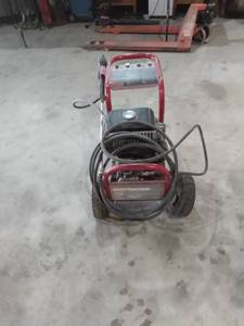 lot 4 image: Coleman powermate gas powered power washer 2400 psi untested has one flat tire