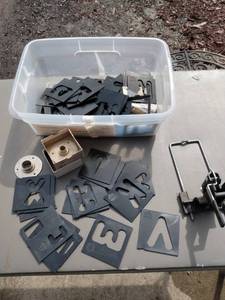 lot 27 image: small tote of lettering templates little lettering machine and bushings for making the letters