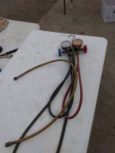 lot 208 image: set of AC charging gauges and hoses