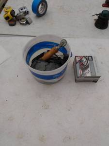 lot 240 image: bucket of tire repair kit and 24-in Bell self sealing inner tube