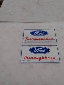 lot 275 image: 2 Ford thoroughbred license plates