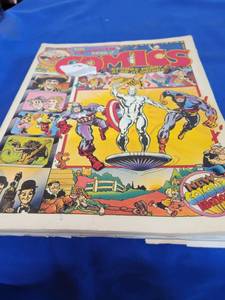 lot 1091 image: George Perry Alan Aldridge the Penguin book of comics Pages has been cut on