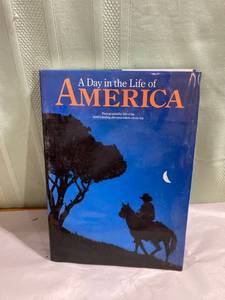 lot 7986 image: Large 14 x 10 a day in the life of America book
