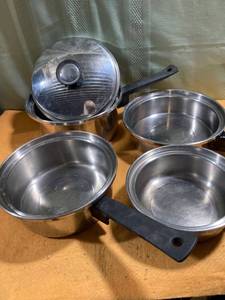lot 9701 image: (5) Peace pot & pans. (1) Lid it fits two of the big pans.