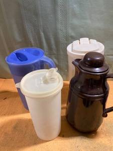 lot 9742 image: Tupperware water holder, 2 pitchers and a coffee carafe