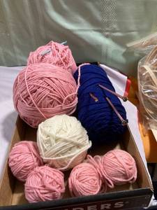 lot 9876 image: Flat of yarn with crochet hooks and knitting needles