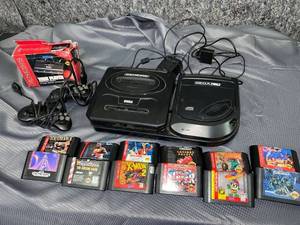 lot 1370 image: Sega and games Vintage video game system