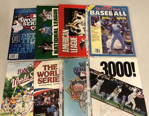lot 91 image: Lot of World Series Programs from 1980s and George Brett and Bo Jackson Game Day Magazines & 1988 American & National League RedGreen Books