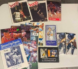 lot 137 image: Baseball, Football, Basketball Media Guides, Yearbooks, Magazines, Wooden Plaque - George Brett, Royals 84 Postseason Guide, Vintage Basketball & More