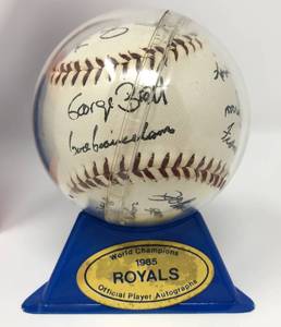 lot 79 image: New In Box 1985 World Series Champions Kansas City Royals Facsimile Signature Baseball with Stand and Box