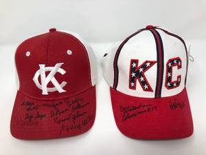 lot 193 image: Two Kansas City Monarchs Hats with Ten Negro League Baseball Players Signatures - Buck ONeil 100th Birthday Party