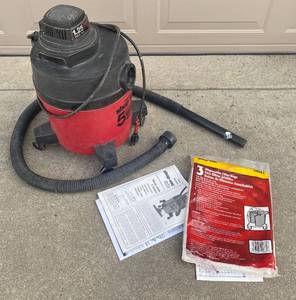 lot 4308 image: WetDry Shop-Vac - 5 Gallon - 1.25 HP - with Bag and Manual