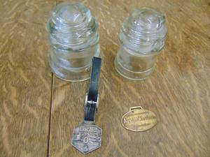 lot 1781 image: Glass Insulators and Watch Fobs