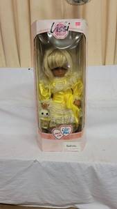lot 3047 image: Lissi doll in yellow dress holding bunny