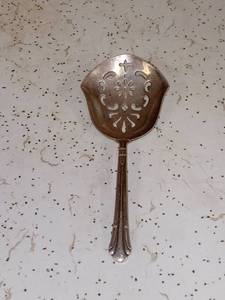 lot 4045 image: Small Gorham Sterling Silver Tomato Serving Spoon