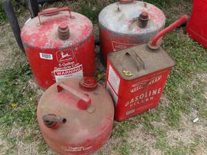 lot 1853 image: Eagle  John Deere Vintage Metal Gas Cans