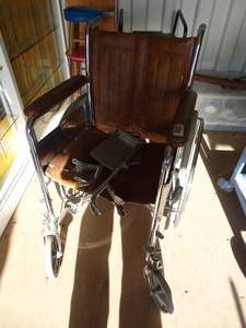 lot 1988 image: Vintage Brown Folding Wheel Chair