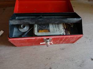 lot 29898 image: Red Metal Tool Box w Chainsaw Blades and Tools
