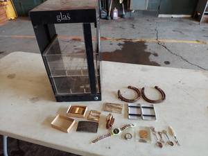 lot 6197 image: display case with Winchester belt buckle and other items