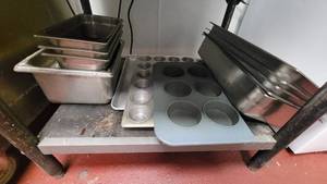 lot 4707 image: Assorted Stainless Steel Hot Well Pans, Half Sheet Aluminum Pan, Cupcake Trays and More