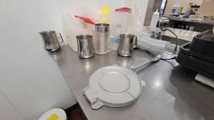 lot 4711 image: 8in Imusa Tortilla Press, Assorted Measuring Cups and More