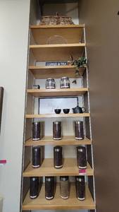 lot 4766 image: (8) 30in Wooden Shelves W Decor - Woven Baskets, Glass Cake Stand, and More